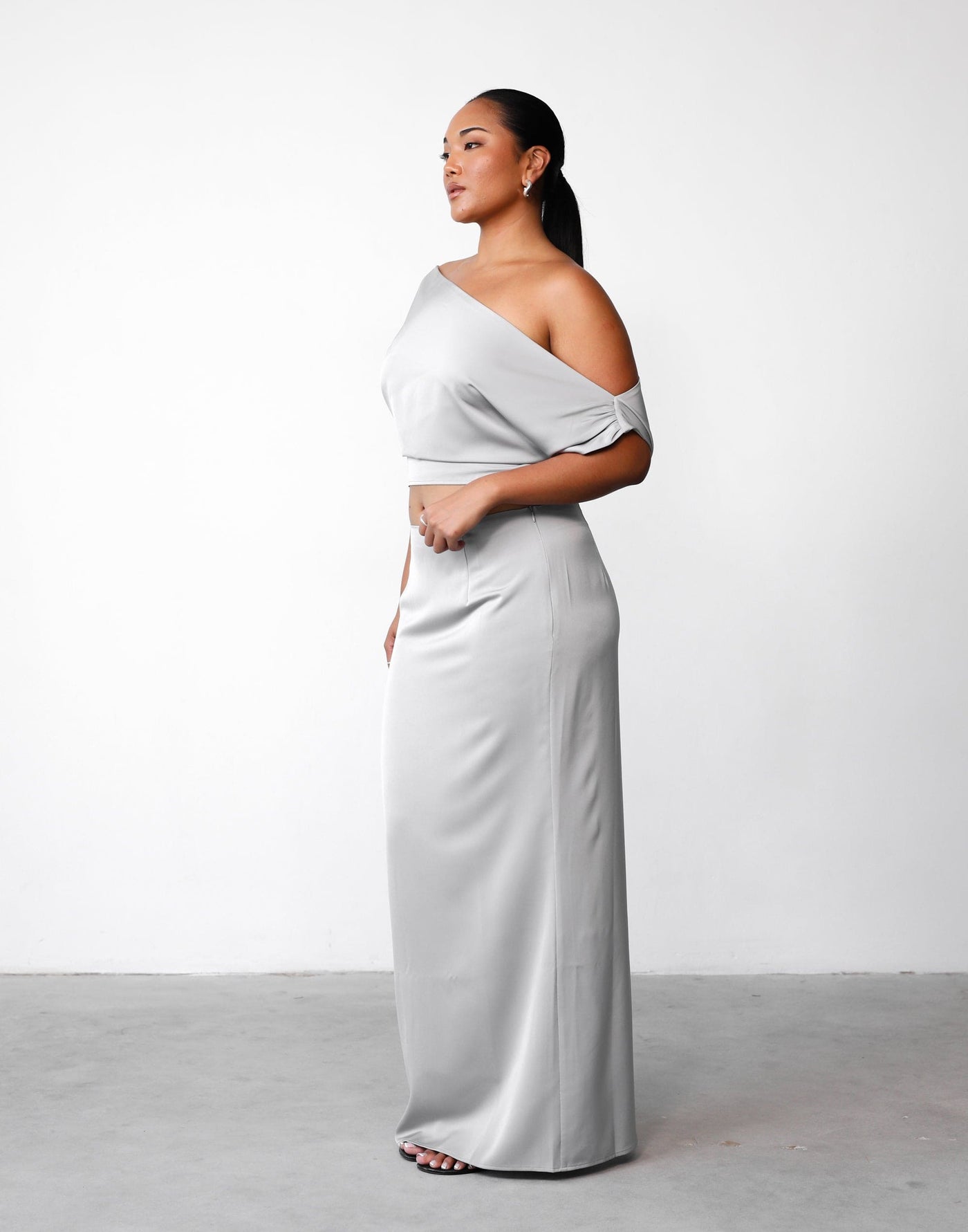 Viviana Top (Silver) | Charcoal Clothing Exclusive - Asymmetrical Neckline Satin Adjustable Waist Top - Women's Top - Charcoal Clothing